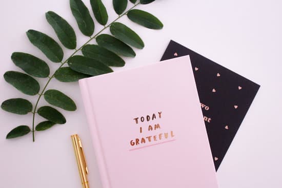 pink book next to a plant