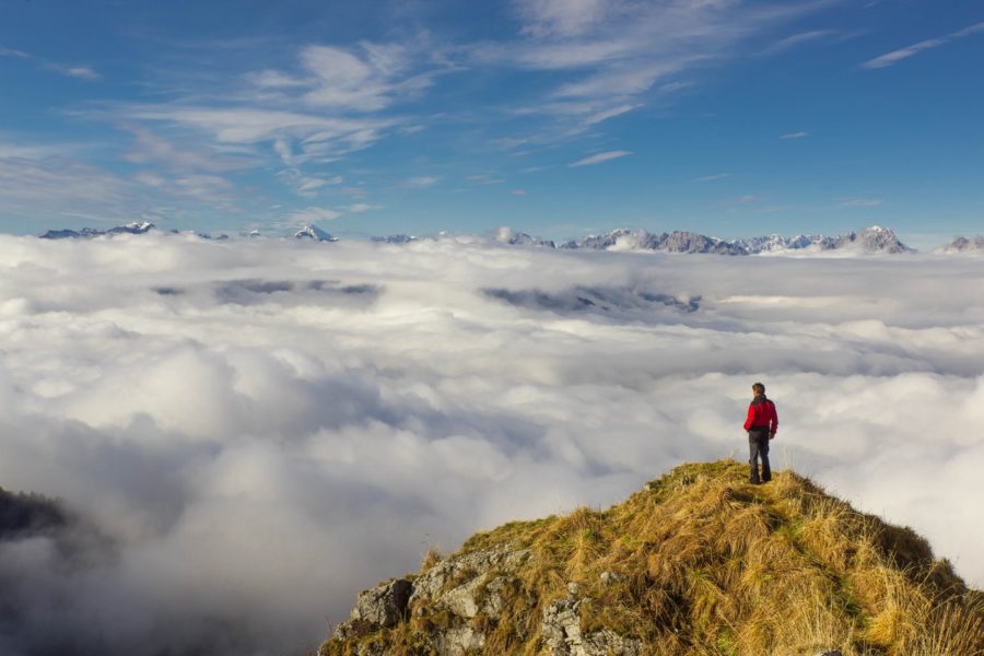 Man at the top of a peak